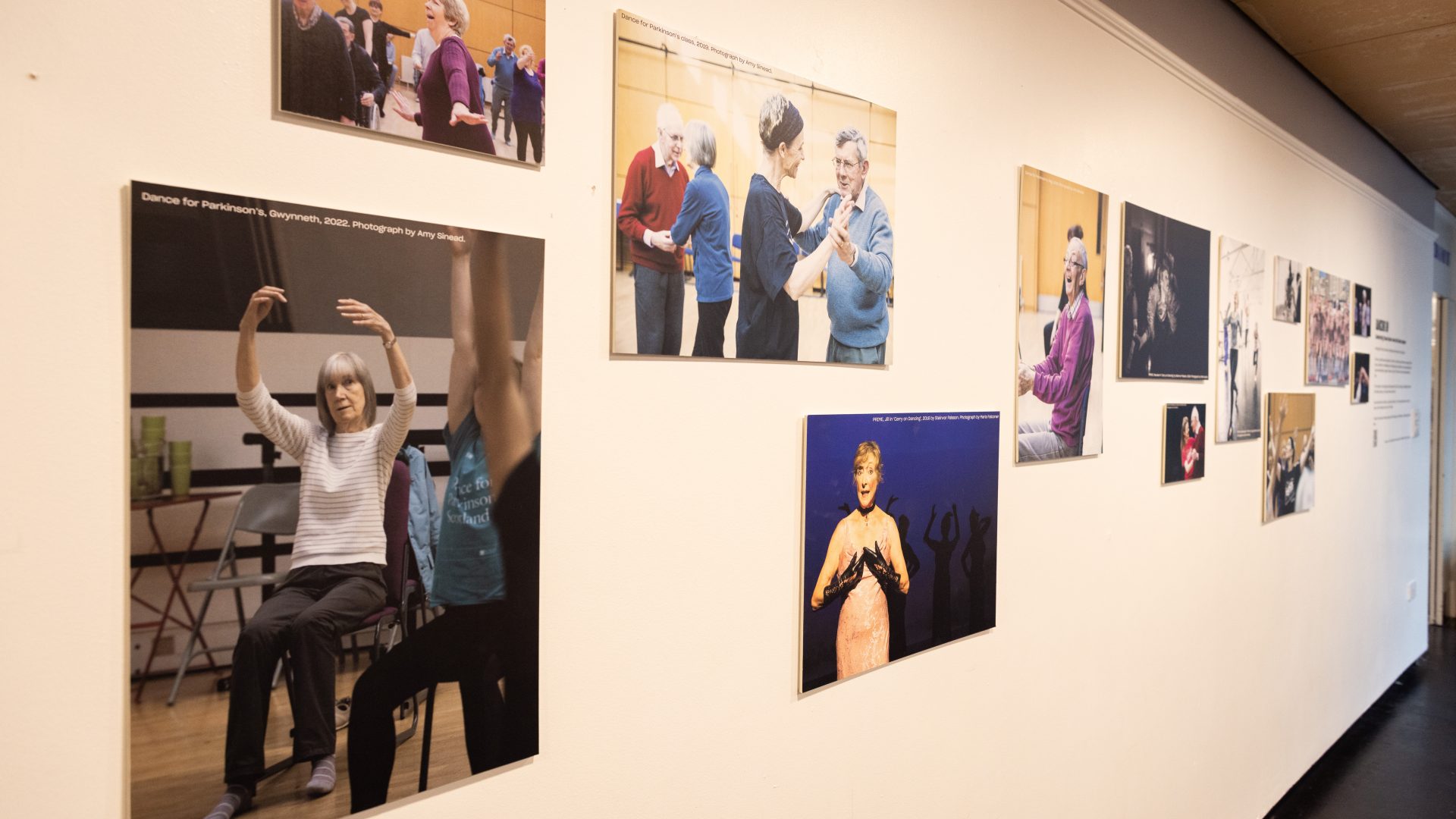 Dancing On Exhibition, Dance Base 2024-25. Image credit Stuart Armitt A side view of the exhibition hanging in Dance Base's upper foyer.