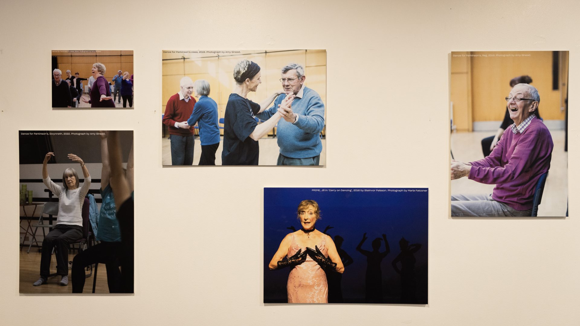 Dancing On Exhibition, Dance Base 2024-25. Image credit Stuart Armitt A front view of the exhibition hanging in Dance Base's upper foyer, showing five of the images displayed.