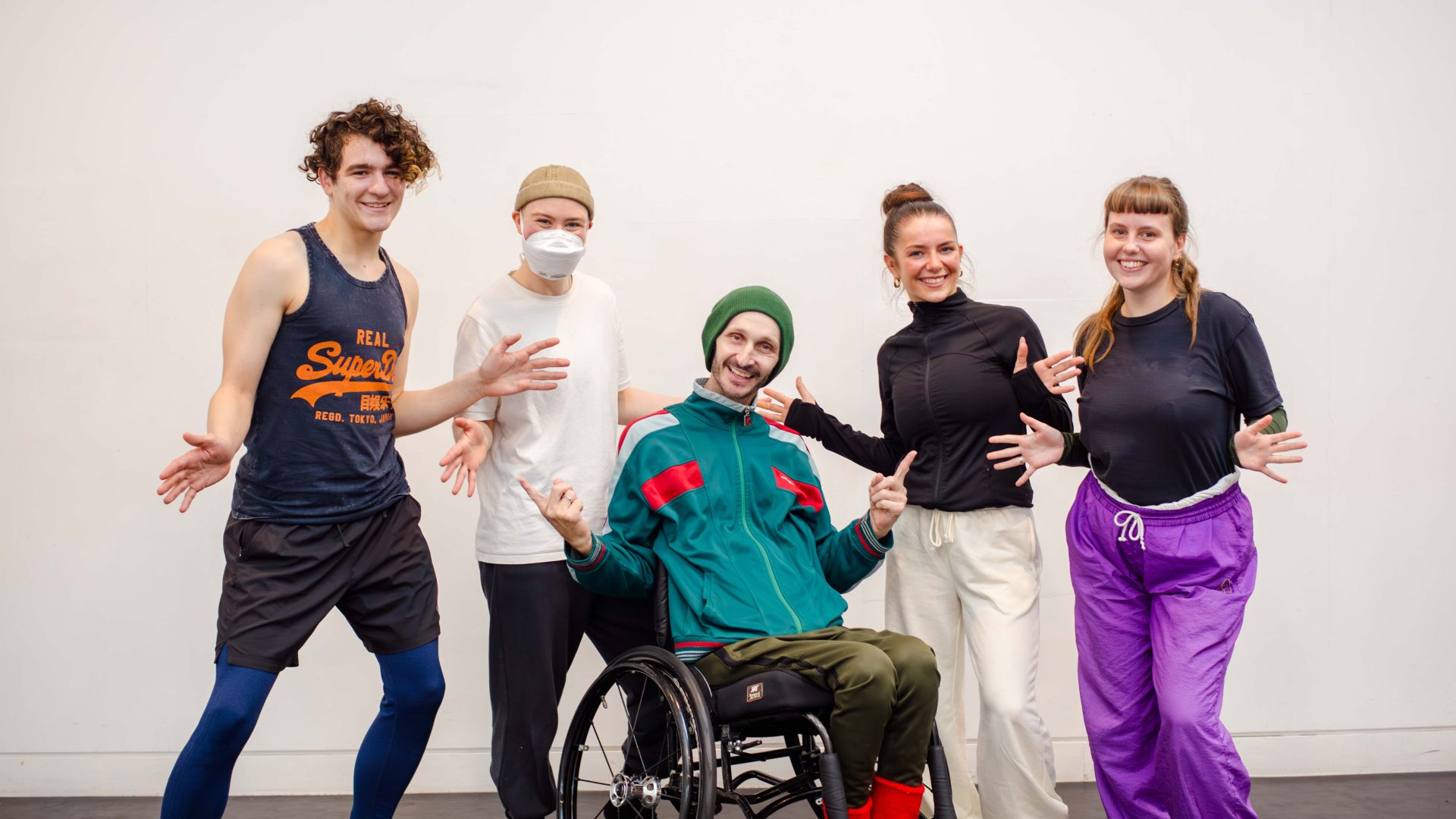 DEBS autumn residency 2025. Image credit: Paul Andrews-287 Four young dancers pose, smiling, with their mentor.