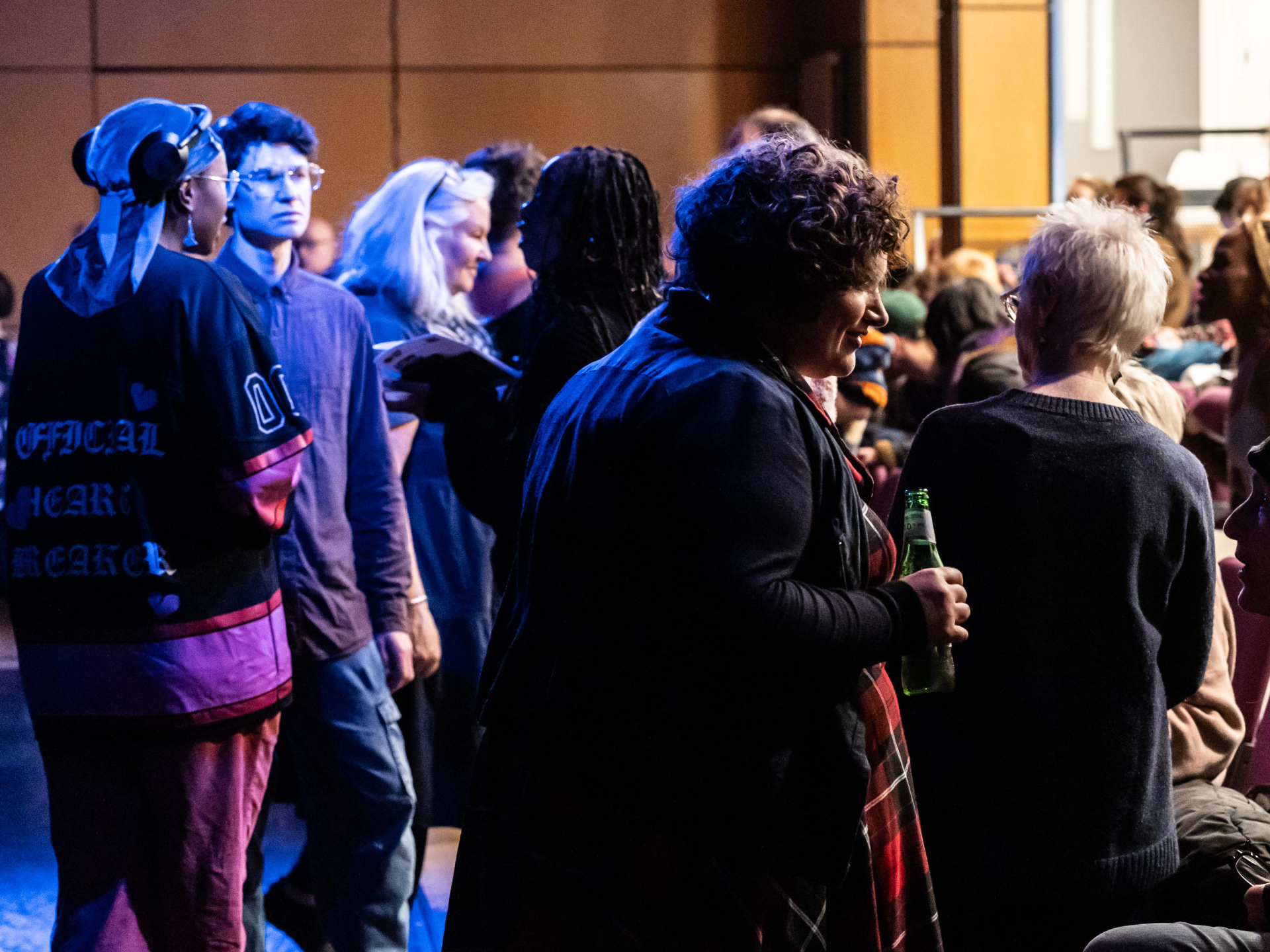 CROPPED Scratch Night, Autumn 2025. Image credit Sally Jubb. A group of people chat and drink after a show in Dance Base's studio 1
