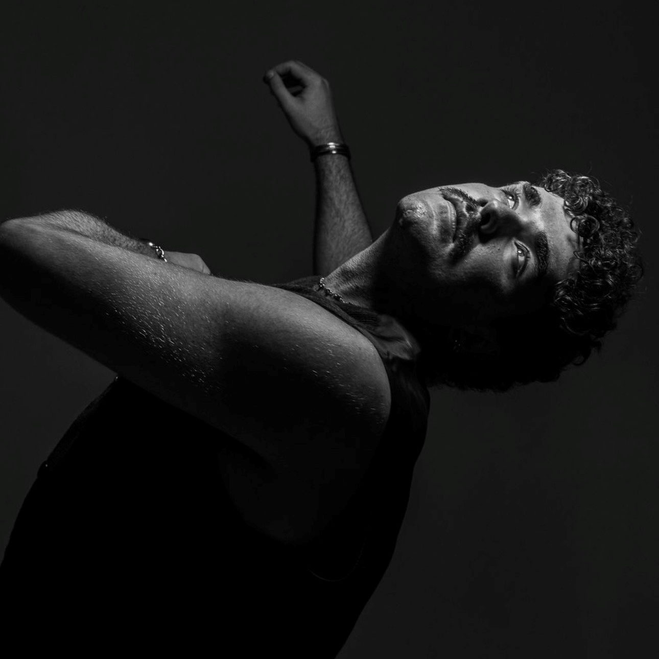 Marcus Burns A black and white photograph of a dancer, leaning back looking up towards the camera